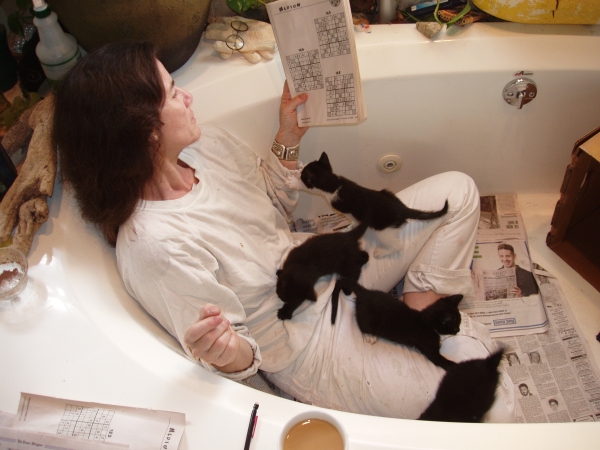 Swarmed by kittens after a hard day of post-Katrina repairs to my grandmother’s house.