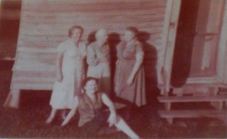 ca.1948, Yola(37), Tante SIn(83), unknown, and Geraldine seated(16), the year Tante Sin died, outside the back bedroom.