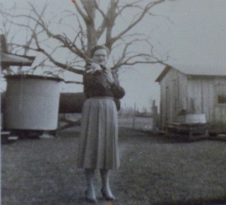 Adeo's house, cistern at back of house and pecan tree in background,1950s-early 60s
